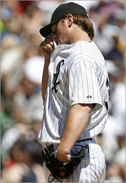 White Sox starting pitcher Gavin Floyd wipes his face after Boston Red Sox's Mike Lowell's three-run home run during the first inning.