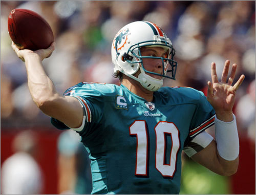 Dolphins quarterback Chad Pennington drops back for a pass.