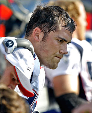 Patriots quarterback Matt Cassel takes a seat on the bench after he was replaced by Kevin O'Connell.