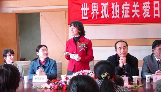 A panel of speakers at a World Autism Awareness Day event in China included (far left) Karen McCabe and (standing) her sister Helen McCabe, founder of The Five Project.