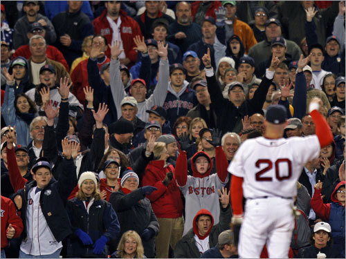 Kevin Youkilis flips the ball into the stands after the third out.