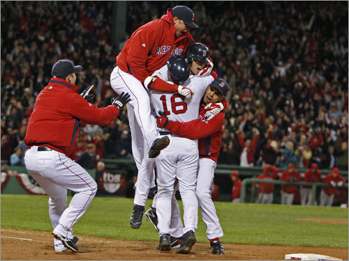 Red Sox players, including Game 4 starter Jon Lester (top), celebrate with Lowrie at first base.