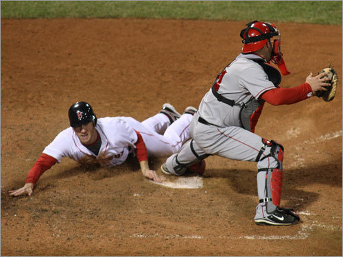 Red Sox left fielder Jason Bay slid into home run in the bottom of the ninth to win the clinching Game 4 against the Angels, 3-2. The win put the Red Sox in the ALCS.