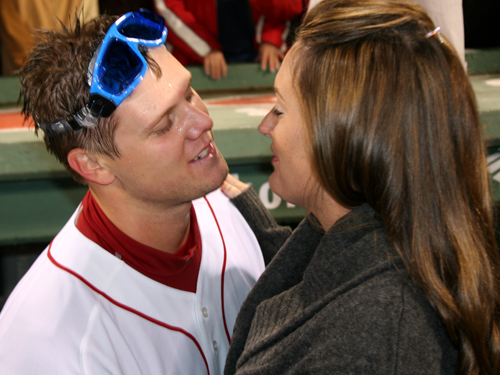 Papelbon gets ready to steal a kiss from his wife Ashley during the postgame celebration after Game 4.