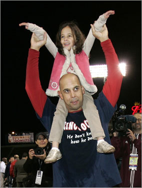 Red Sox reserve Alex Cora celebrated on the field after the win.