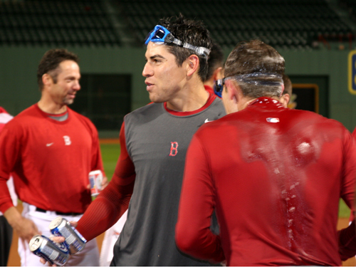 Ellsbury (left) celebrates with a drenched Lowrie (right) on the field after the Game 4.