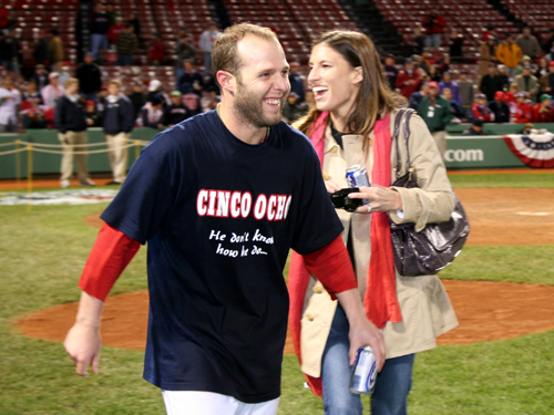 Pedroia and his wife Kelly share a laugh on the field after the Game 4 walkoff win. Pedroia drove in the Sox' second run when he doubled home Jason Varitek in fifth inning.