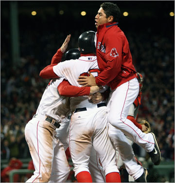 Jacoby Ellsbury (right) and teammates surround Bay.