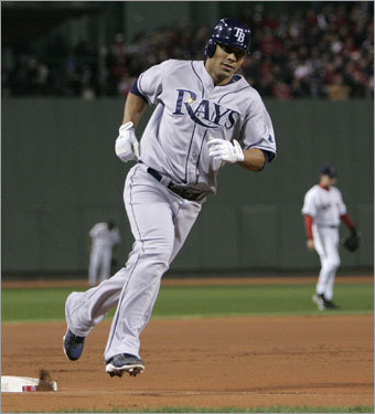Rays first baseman Carlos Pena rounded third base after hitting a two-run home run in the first inning.