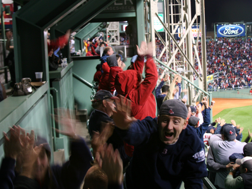 Fans in the Monster seats erupt after J.D. Drew hit a two-run home run in the eighth inning to bring the Sox to within one run of the Rays at 7-6.