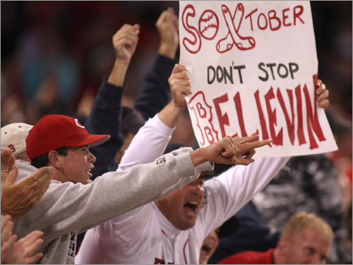 Fans held up a sign imploring the Fenway crowd to keep the faith.