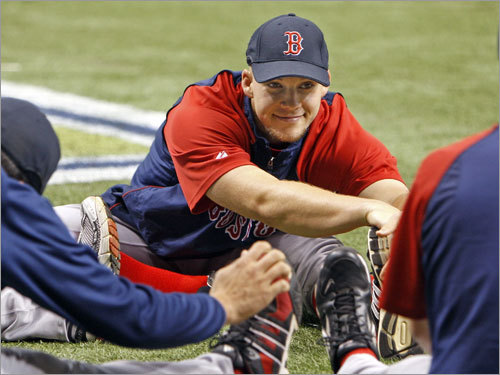 Sox reliever Justin Masterson stretched out with teammates prior to the game.