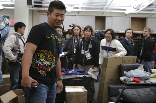 Daisuke Matsuzaka packed up his locker as media members looked on.