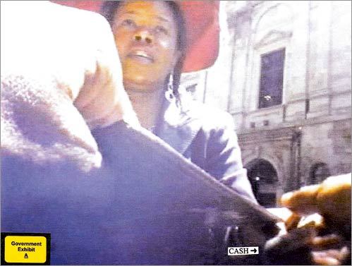 Former state senator Dianne Wilkerson was sentenced to 3 1/2 years in prison after pleading guilty to taking $23,500 in bribes. Wilkerson was snared in an undercover investigation by Boston police and the FBI. Read on to see some of the surveillance footage from the case. Left: On June 5, 2007, Wilkerson met a cooperating witness at the Scollay Square Restaurant, where she accepted $500.