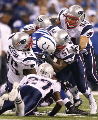 Colts RB Joseph Addai was brought down by host of Patriots defenders in the first quarter.
