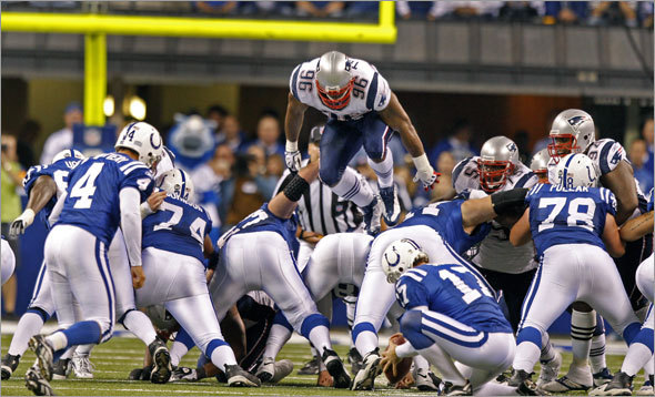 Colts place kicker Adam Vinatieri boots what would prove to be the game-winning 52-yard field goal in the middle of the forth quarter, despite the efforts of Adalius Thomas, who tried to climb the ladder and get high enough to block it. Thomas was flagged for a penalty for his efforts.