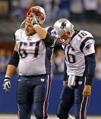 Patriots center Dan Koppen and quarterback Matt Cassel walk off the field after the interception by the Colts Bob Sanders late in the fourth quarter.