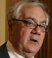 Representative Barney Frank threatened to tie up financial industry rescue money unless some is used to modify troubled mortgages.