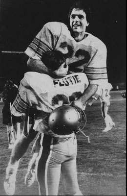 1984: BC 47, Miami 45 In one of the most famous plays in college football history, Doug Flutie threw a last-second 48-yard 'Hail Mary' touchdown pass to receiver Gerard Phelan in the end zone, giving the Eagles an improbably victory over the mighty Hurricanes at the Orange Bowl Nov. 23, 1984. Flutie, who won the Heisman Trophy that season, scrambled to his right, narrowly averting a sack, then launched the football from his own 37-yard line, requiring the 5-foot-9-inch QB to throw the ball at least 63 yards. 1984: BC 47, Miami 45 In one of the most famous plays in college football history, Doug Flutie threw a last-second 48-yard 'Hail Mary' touchdown pass to receiver Gerard Phelan in the end zone, giving the Eagles an improbably victory over the mighty Hurricanes at the Orange Bowl Nov. 23, 1984. Flutie, who won the Heisman Trophy that season, scrambled to his right, narrowly averting a sack, then launched the football from his own 37-yard line, requiring the 5-foot-9-inch QB to throw the ball at least 63 yards.