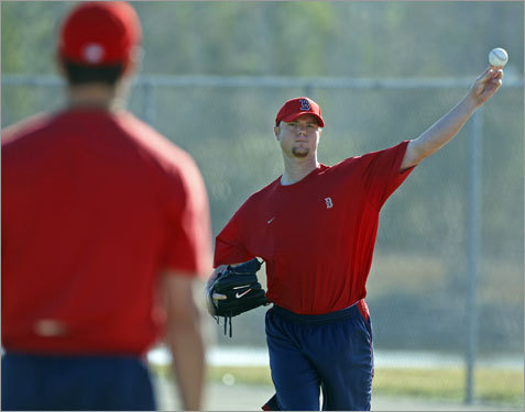  Pitcher Jon Lester (right) plays catch with Beckett (left) on a field Wednesday morning. (Globe Staff Photo / Jim Davis)