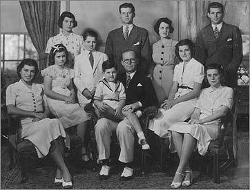A Kennedy family portrait taken in Bronxville, NY. Seated (left to right): Eunice, Jean, Edward, Joseph Sr., Patricia, and Kathleen. Standing: Rosemary, Robert, John, Rose, and Joseph Jr.