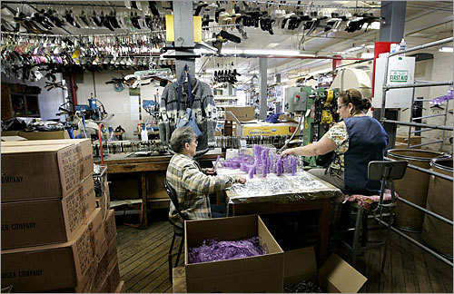 Henry Hangar Company has also retained Expense Reduction Analysts, which gets paid a percentage of the savings it can provide, to examine other costs, from health and property insurance to workers' compensation. Here, workers assemble hangers.