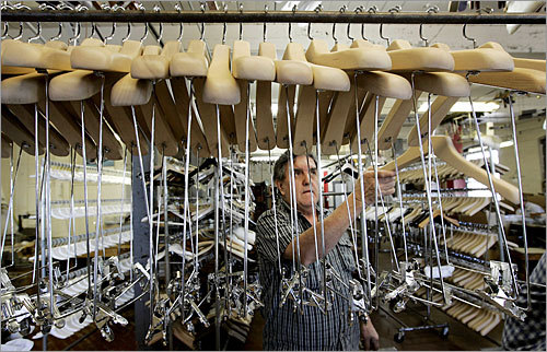 Dario Paramo assembles hangers at Henry Hanger Company.