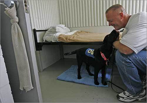 Peter Hilliard is an inmate at Northeastern Correctional Center, which participates in the National Education for Assistance Dog Services program. The prison pup partnership program lets minimum security inmates raise and train puppies on basic obedience and service tasks to help the disabled. Hilliard is with Morgan, who sleeps on the blue towel in the room.