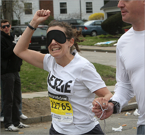 Leslie Nordin of Hingham wore a blindfold as part of her fundraising effort for Perkins School for the Blind, as well as her son Sawyer. She was guided by her husband Dayron. Family members said Nordin raised $30,000.