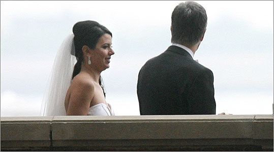 Newlyweds Linda Pizzuti (left) and Red Sox owner John Henry arrive at Rowes Wharf after having their wedding ceremony on Henry's yacht 'Iroquois.'