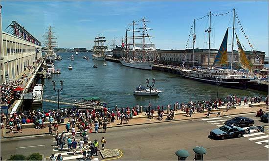 People stopped to take photos of the Tall Ships docked.