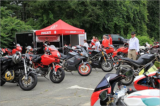 A fleet of Ducatis lined the walkway up to the Ferraris.