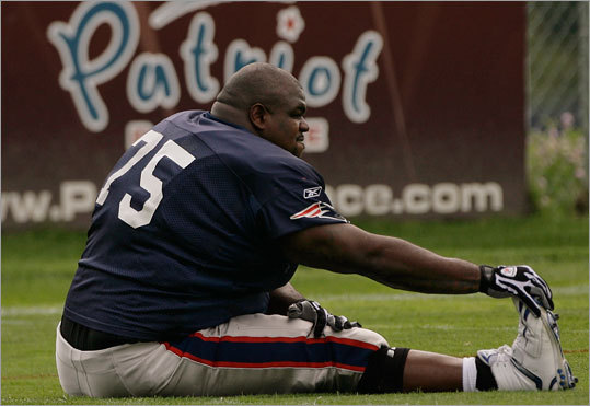 Vince Wilfork stretches during training camp.