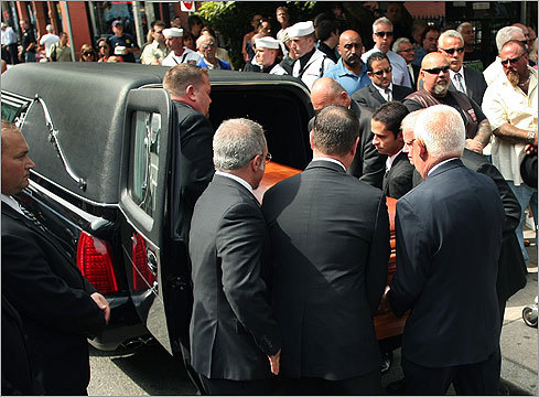 Gennaro Angiulo's casket was lifted into the hearse after the service.