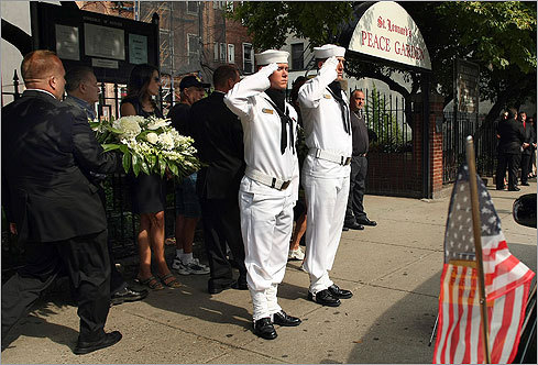 A funeral arrangement was carried past two Navy honor guards who stood by the hearse in front of the church. Angiulo served in the Navy in World War II.
