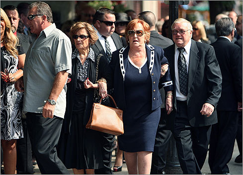 Funeralgoers arrived at the church.