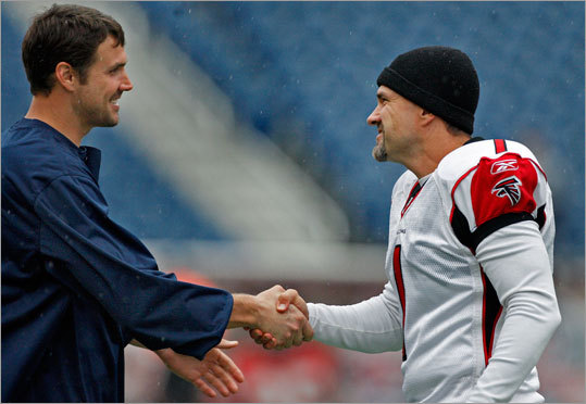Patriots punter Chris Hanson (left) and Falcons place kicker Jason Elam (right) greeted each other on the field while loosening up before the game.