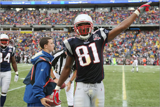 Randy Moss celebrated a first down near the sideline in the third quarter. Moss had 116 receiving yards Sunday.