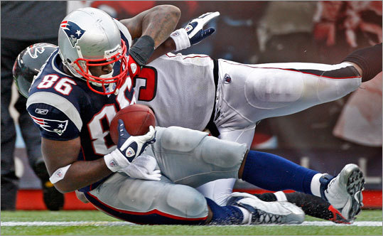Patriots tight end Chris Baker dragged a Falcons defender into the end zone with him as he scored a fourth-quarter touchdown on a 36-yard reception from Tom Brady (not pictured) that capped the scoring in New England's 26-10 victory.