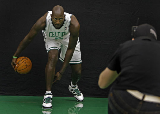 The Celtics held their annual 'Media Day' this afternoon at the team's training headquarters in Waltham. Players posed for photos, signed autographs and did interviews with local and national newspapers, radio stations and television outlets. Here Kevin Garnett gets low on his surgically repaired knees as he poses while dribbling.
