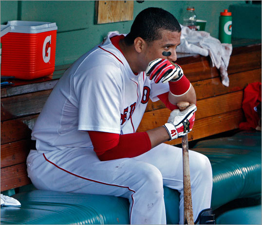 His season over, Red Sox catcher Victor Martinez sat in the dugout after the Red Sox were swept by the Angels in the ALDS.