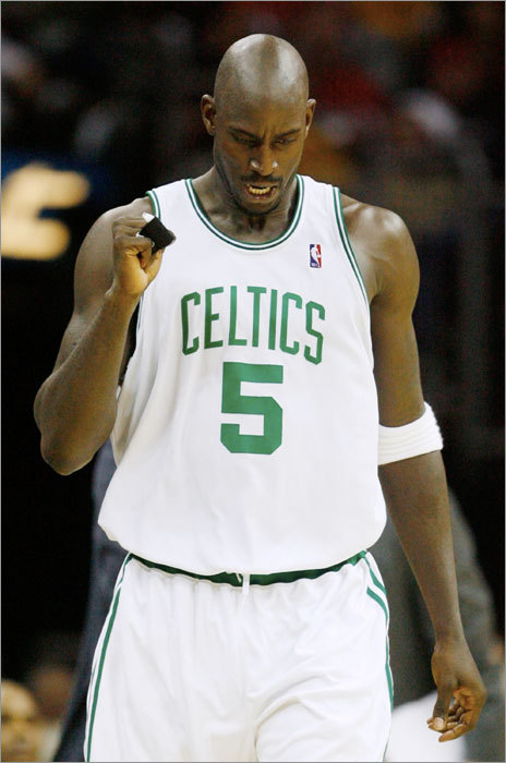 Kevin Garnett led the Celtics past the Cavaliers 95-89 at Quicken Loans Arena in the NBA season opener Tuesday.