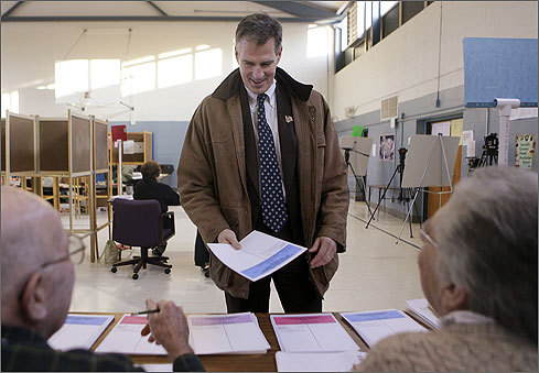 Republican state Senator Scott Brown picked up his ballot before casting his vote at the Delaney School in Wrentham.