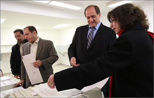 Capuano (second from right) turned in his vote. His wife, Barbara, (right) and his sons Joe and Mike (left) voted alongside him.