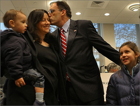 City year cofounder and Democrat Alan Khazei voted in Brookline Town Hall with his family. Khazei kissed his wife, Vanessa Kirsch, before voting.