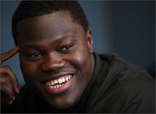 University of Massachusetts offensive tackle Vladimir Ducasse, originally from Haiti, speaks with a reporter on the school's campus, in Amherst, on Friday, Jan. 22. Ducasse, who has lived in the United States since he was 14, is headed to the Senior Bowl college all-star football game with thoughts of impressing pro scouts, and concerns about his native Haiti.