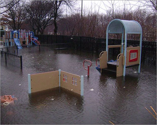 A flooded playground at the Alewife Brook Parkway in Arlington on Monday.