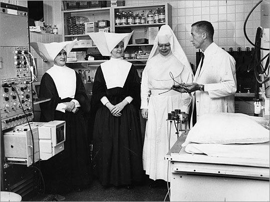 A Carney Hospital administrator meets with nuns at St. Elizabeth Hospital in 1964.