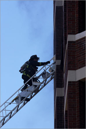 Firefighters scaled ladders to get closer to the flames.