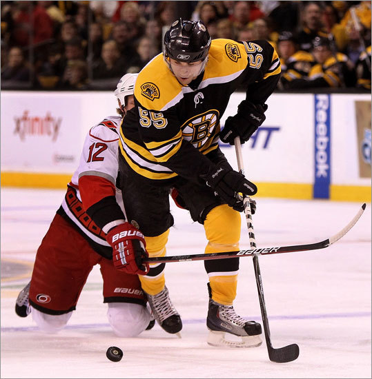 Carolina Hurricanes center Eric Staal (12) tried to slow down Bruins defenseman Johnny Boychuk (55). The Bruins scored three short-handed goals en route to a 4-2 win which clinched a playoff spot.